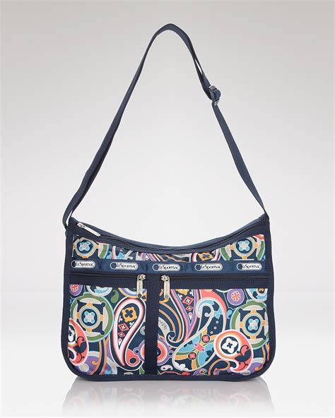 Lesportsac crossbody - Size: OS Lesportsac. nataliewssj1976. 1. LeSportSac Striped Colorblock Woman's Adjustable Crossbody Handbag/Purse W/Pouch. $18. Size: OS Lesportsac. syd_chlo_co. 2. Lesportsac Women's Crossbody Daisy Do Floral Print Medium White/Multicolor Bag.